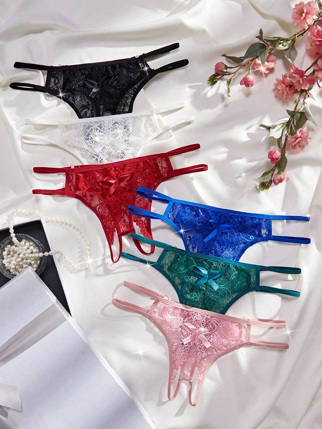 6-piece women's crotchless thong panties set in lace with low rise design and plain pattern