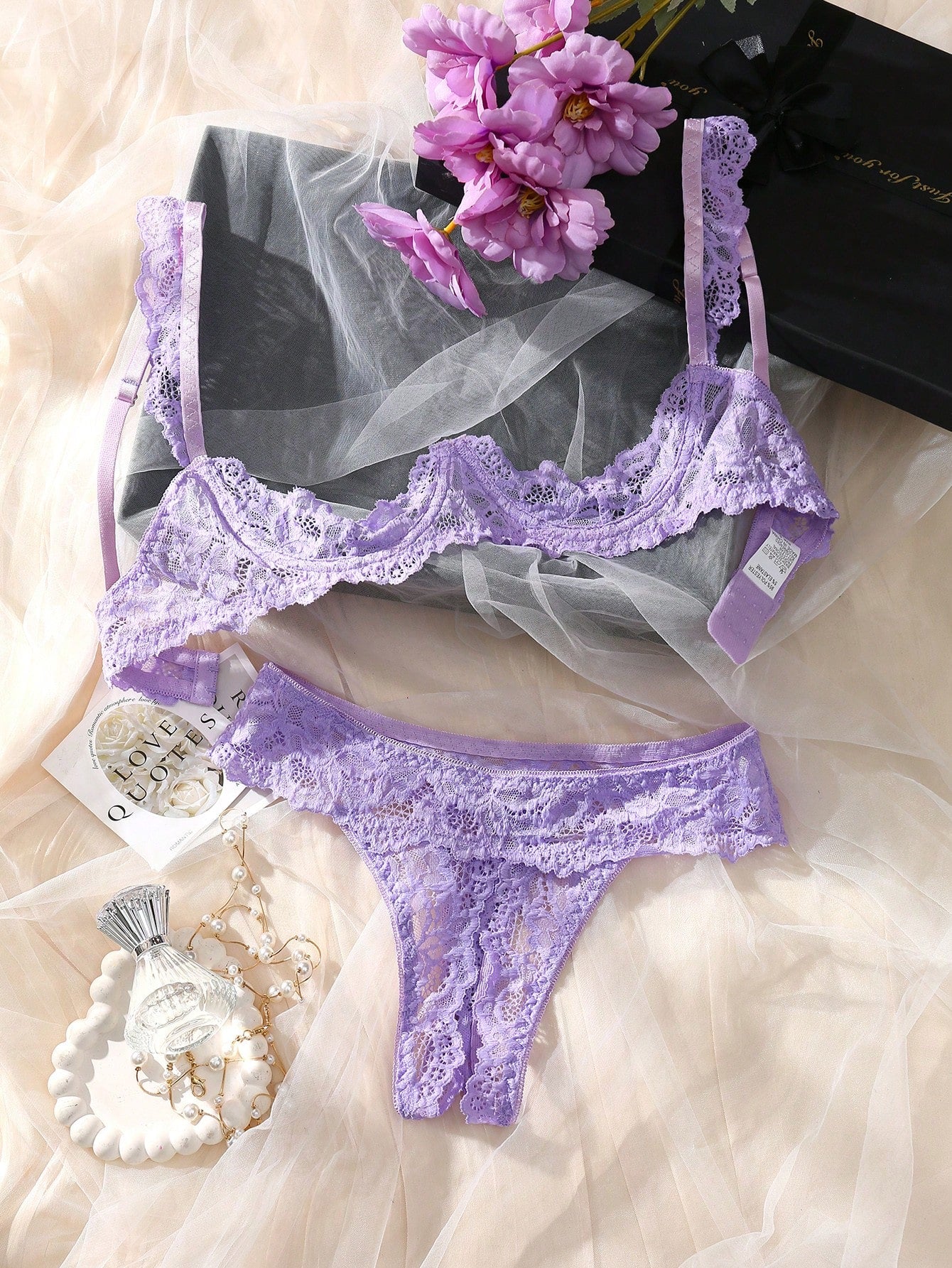 Women's sheer lace underwire bra and thong set with open cup bra, adjustable spaghetti straps, and matching low rise V-string thong in a 2-piece lingerie set.
