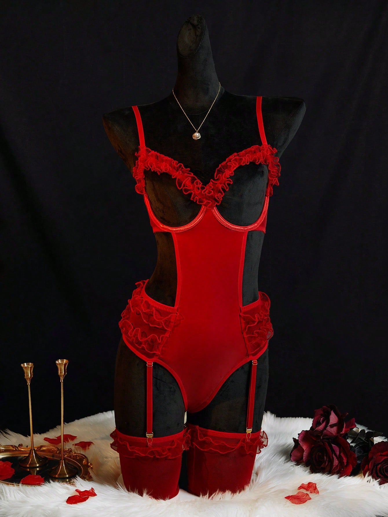 Red two-piece women's lingerie bodysuit set with semi-sheer mesh, coated fabric panels, cutout design, underwire cups, adjustable spaghetti straps, and matching stockings.
