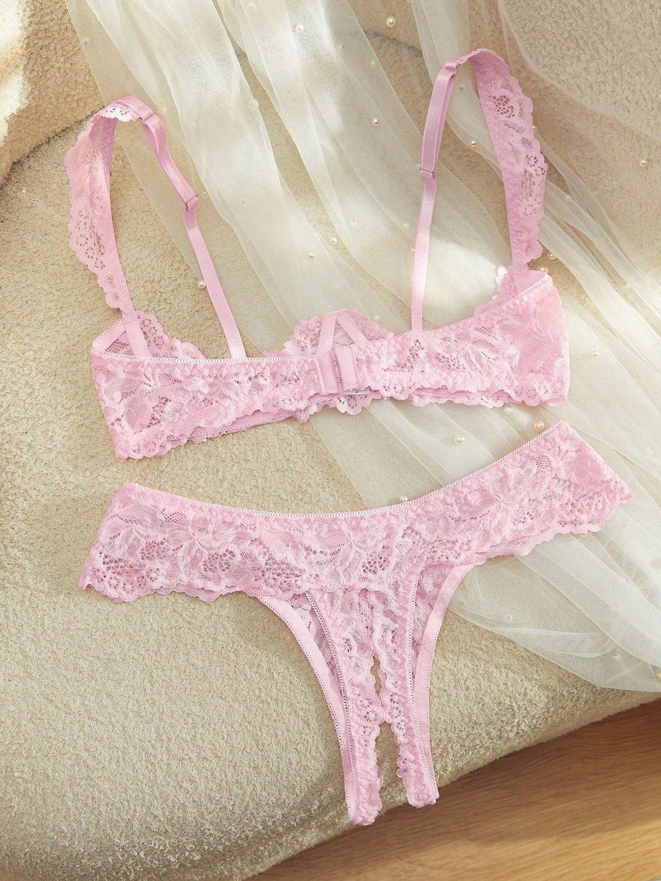 Women's sheer lace underwire bra and thong set with open cup bra, adjustable spaghetti straps, and matching low rise V-string thong in a 2-piece lingerie set.
