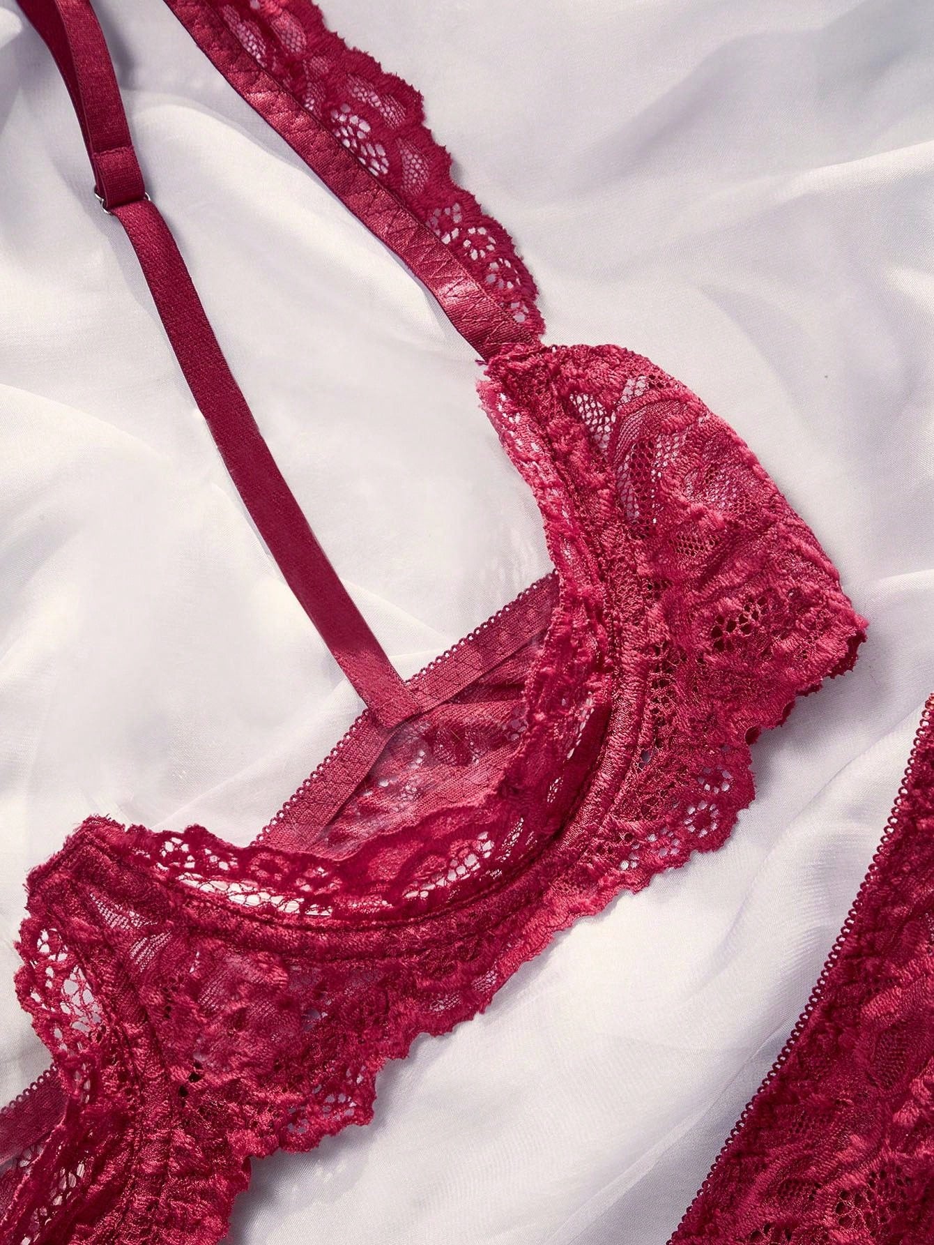 Women's sheer lace underwire bra and thong set with open cup bra, adjustable spaghetti straps, and matching low rise V-string thong in a 2-piece lingerie set.