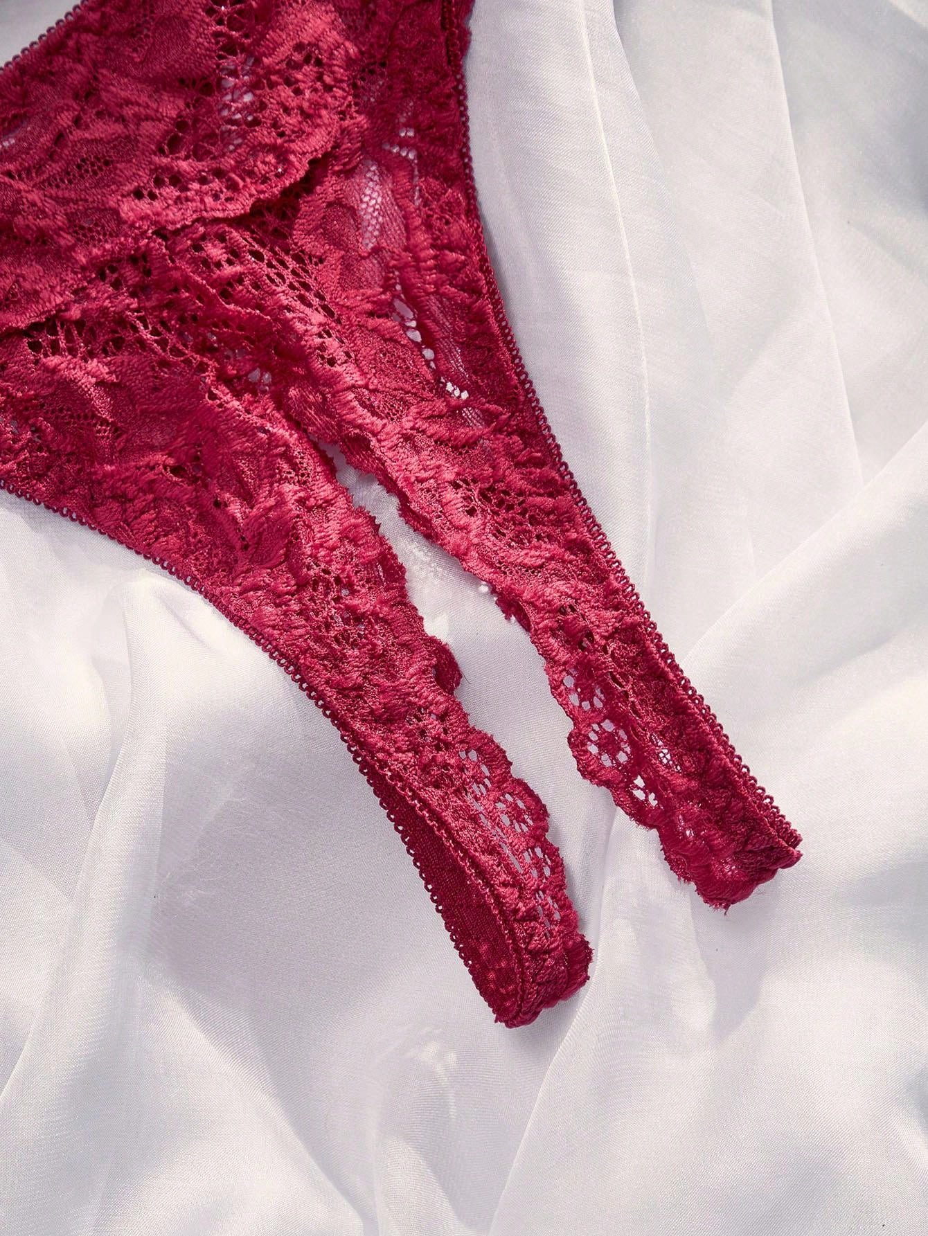 Women's sheer lace underwire bra and thong set with open cup bra, adjustable spaghetti straps, and matching low rise V-string thong in a 2-piece lingerie set.