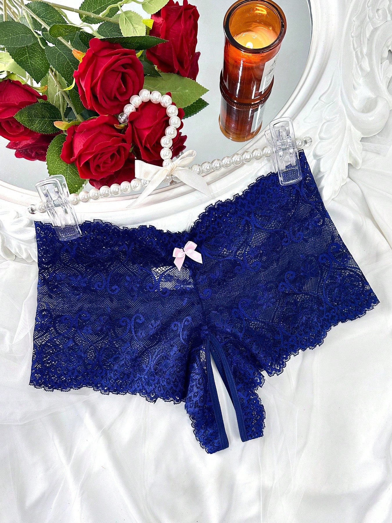 Black women's crotchless lace briefs with a mid-rise fit, textured pattern, cut-out split detail, and slight-stretch romantic styling.