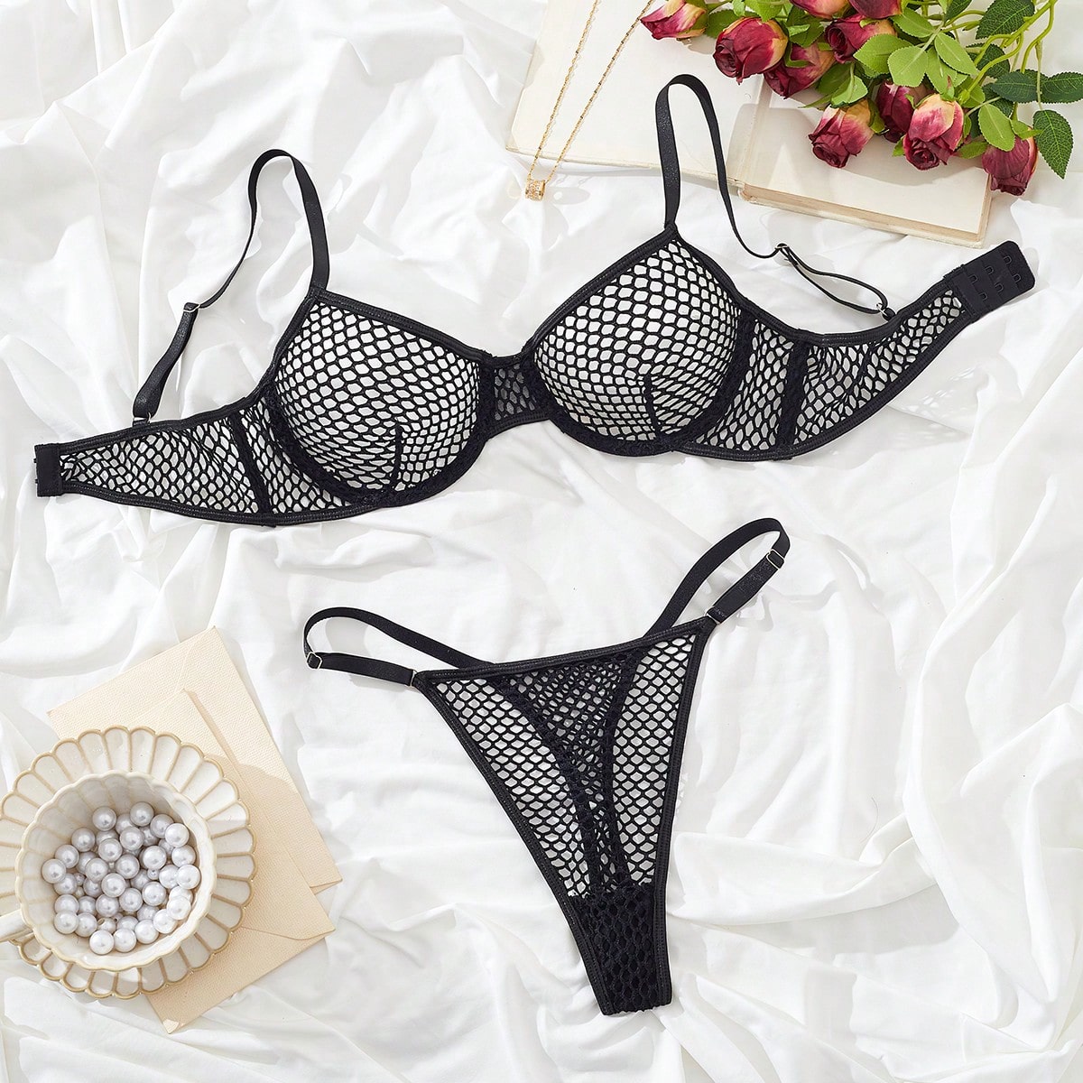 Women's 2-piece mesh lingerie set with hollow out detail, underwire bra, adjustable spaghetti straps, and matching low-rise thong panties in a sheer plain design.