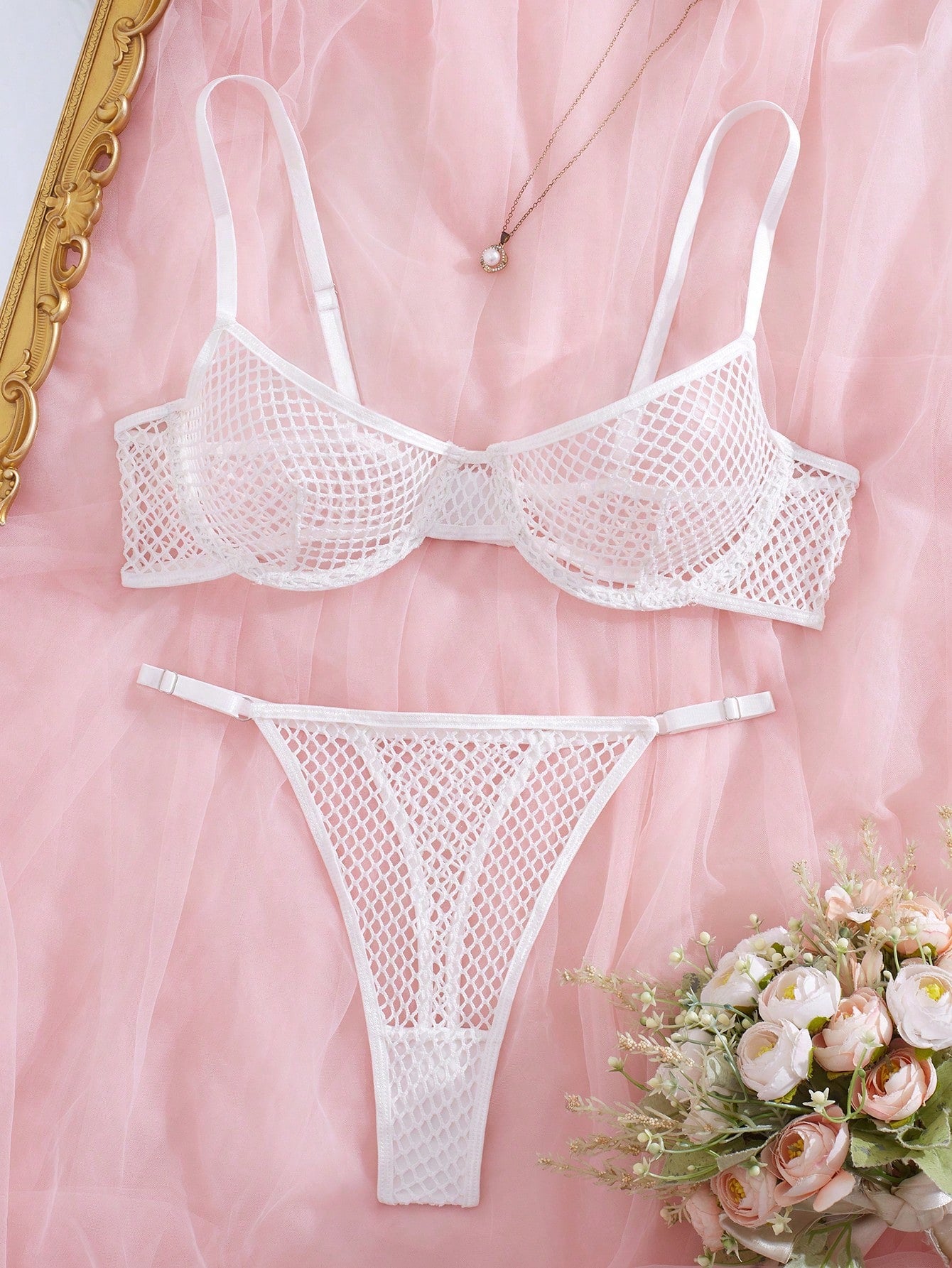Women's 2-piece mesh lingerie set with hollow out detail, underwire bra, adjustable spaghetti straps, and matching low-rise thong panties in a sheer plain design.
