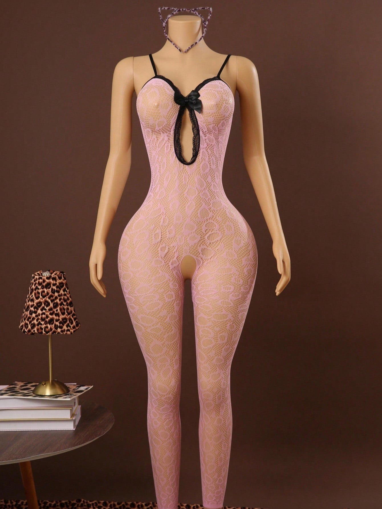 Sleeveless pink lingerie bodysuit 2 piece set with sheer textured fabric, backless design, contrast lace, knot detail, adjustable spaghetti straps, and cropped low rise fit.