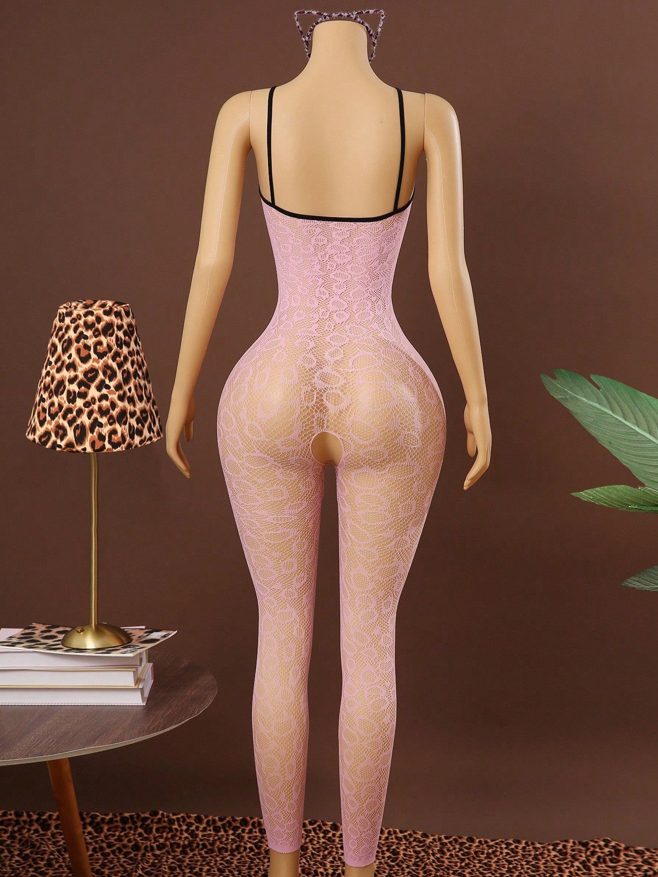 Sleeveless pink lingerie bodysuit 2 piece set with sheer textured fabric, backless design, contrast lace, knot detail, adjustable spaghetti straps, and cropped low rise fit.