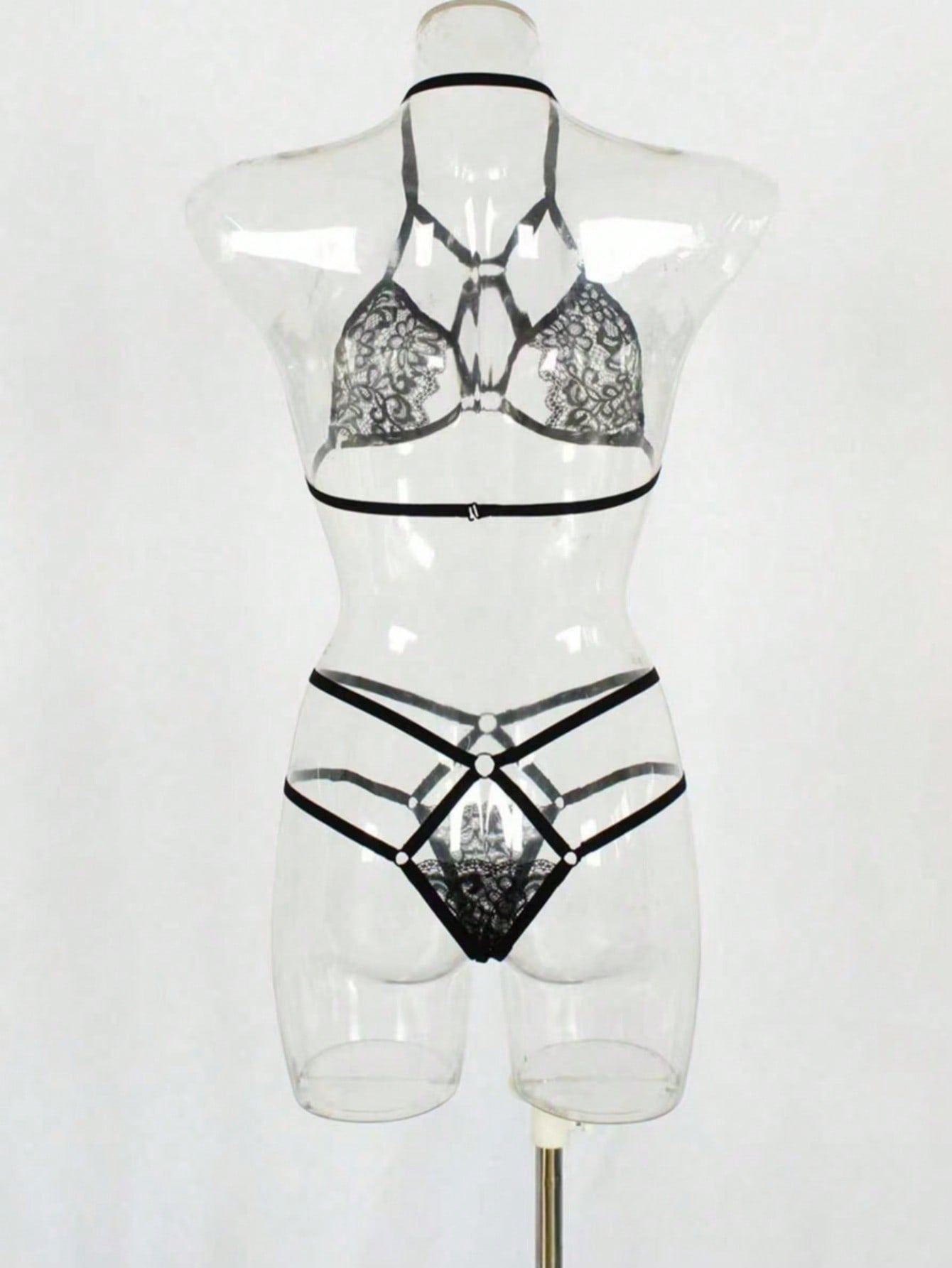 Women's two-piece lingerie set with contrast lace and mesh, featuring a wireless bralette with adjustable spaghetti straps and a low-rise thong.