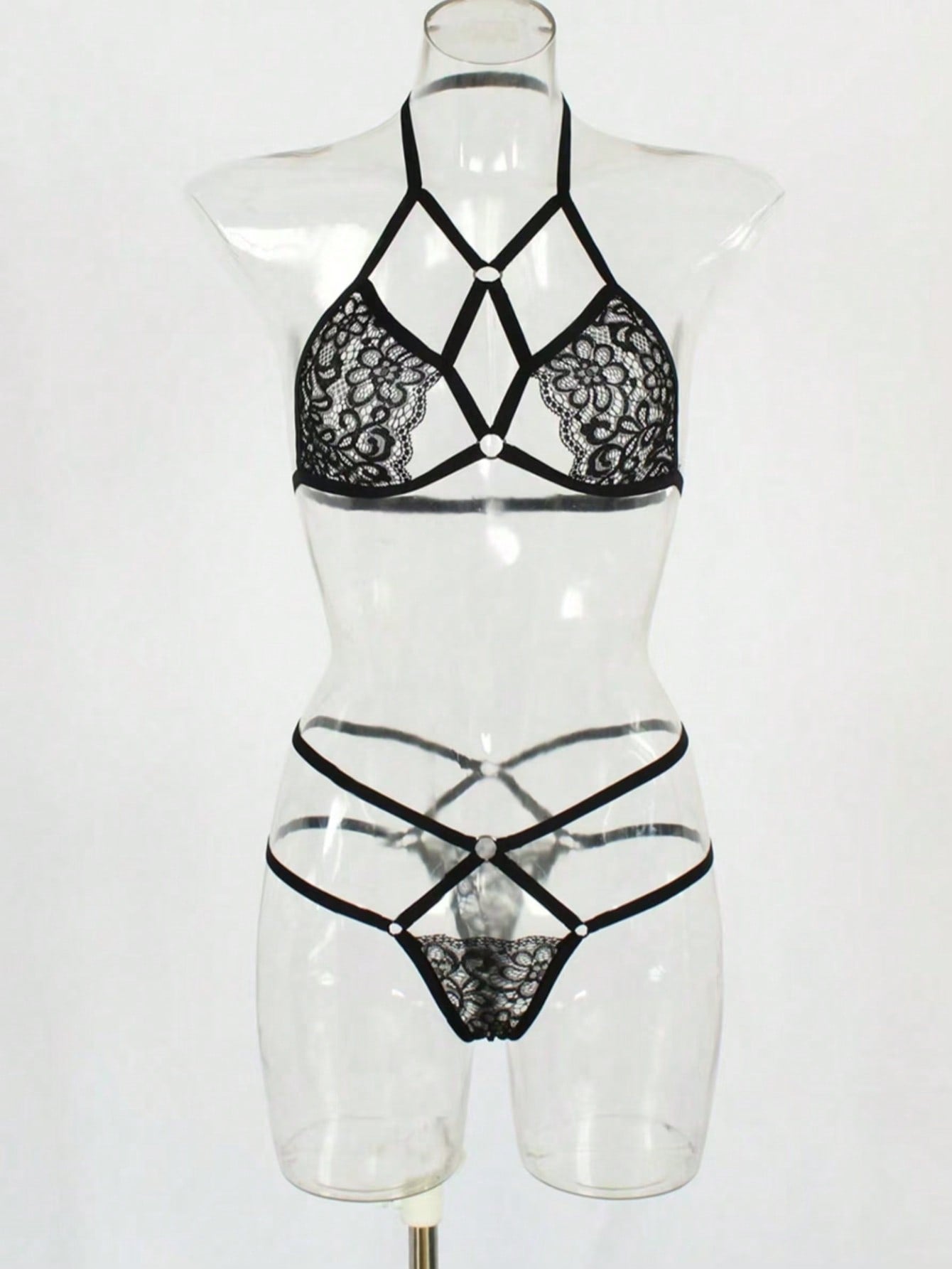 Women's two-piece lingerie set with contrast lace and mesh, featuring a wireless bralette with adjustable spaghetti straps and a low-rise thong.