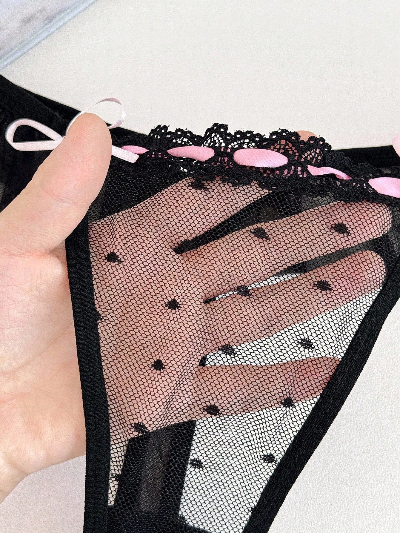 Women's ruffled mesh thong panty with bow detail and mid rise fit, plain design, 1-piece style