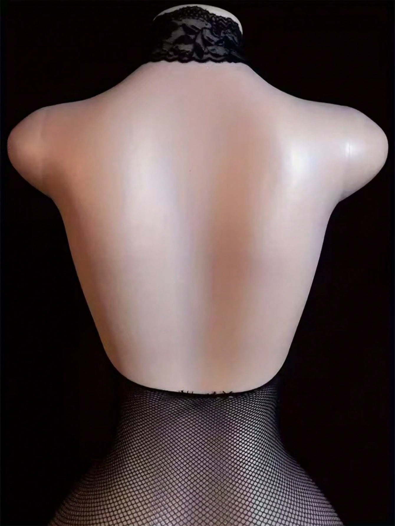 Black sheer fishnet bodystocking for women with cut-out detail, crossback straps, scoop neckline, and sleeveless high-stretch design.