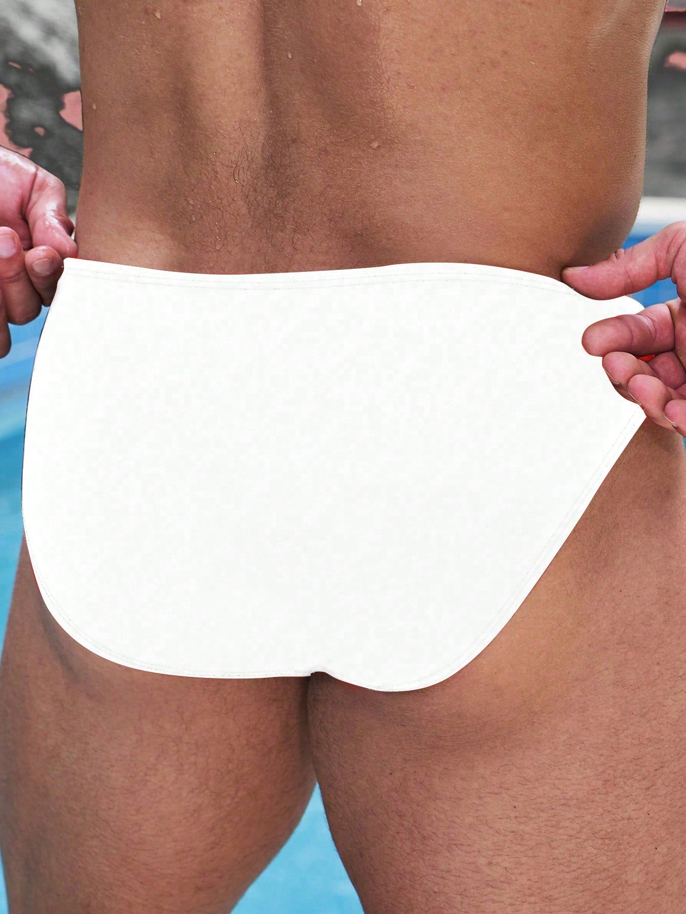 Men's solid swim briefs with O-ring detail, high waist, short racer cut, and high-stretch polyamide elastane fabric.