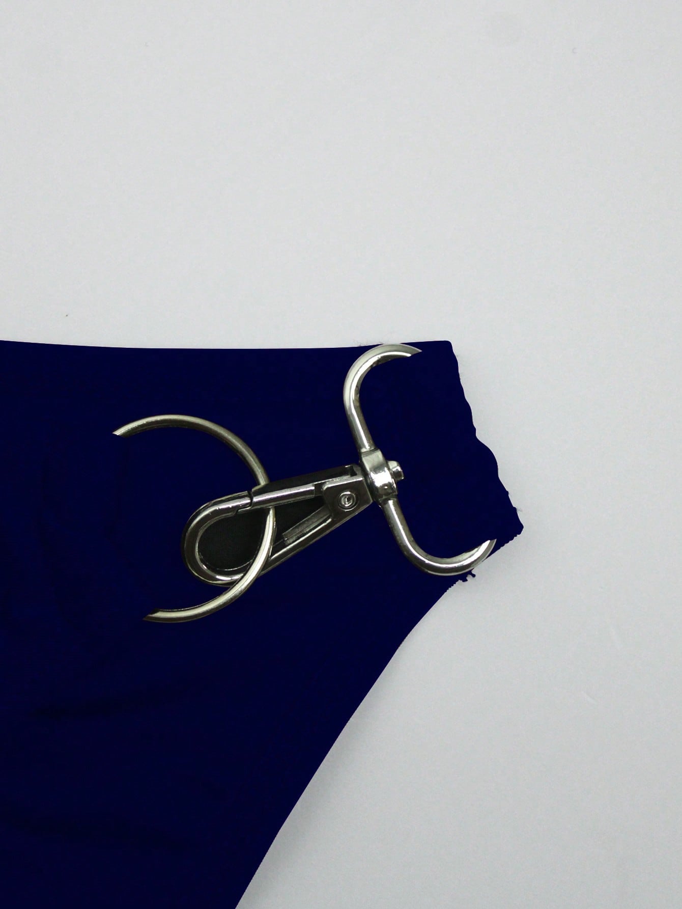Men's solid swim briefs with O-ring detail, high waist, short racer cut, and high-stretch polyamide elastane fabric.