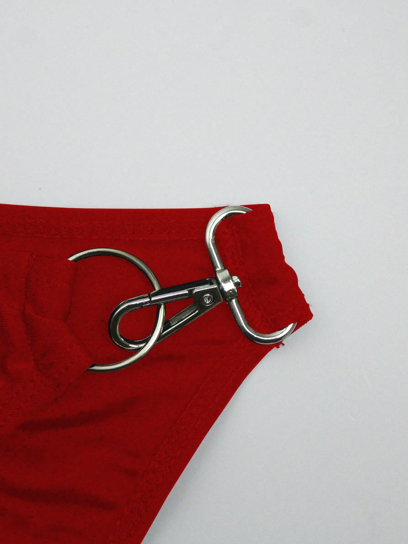 Men's solid swim briefs with O-ring detail, high waist, short racer cut, and high-stretch polyamide elastane fabric.