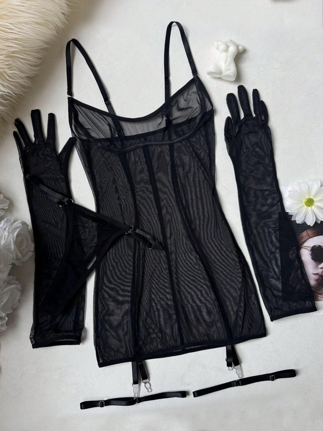Women's black sheer mesh lingerie set with adjustable spaghetti straps, wireless design, V-string panty, garter belt, and matching gloves