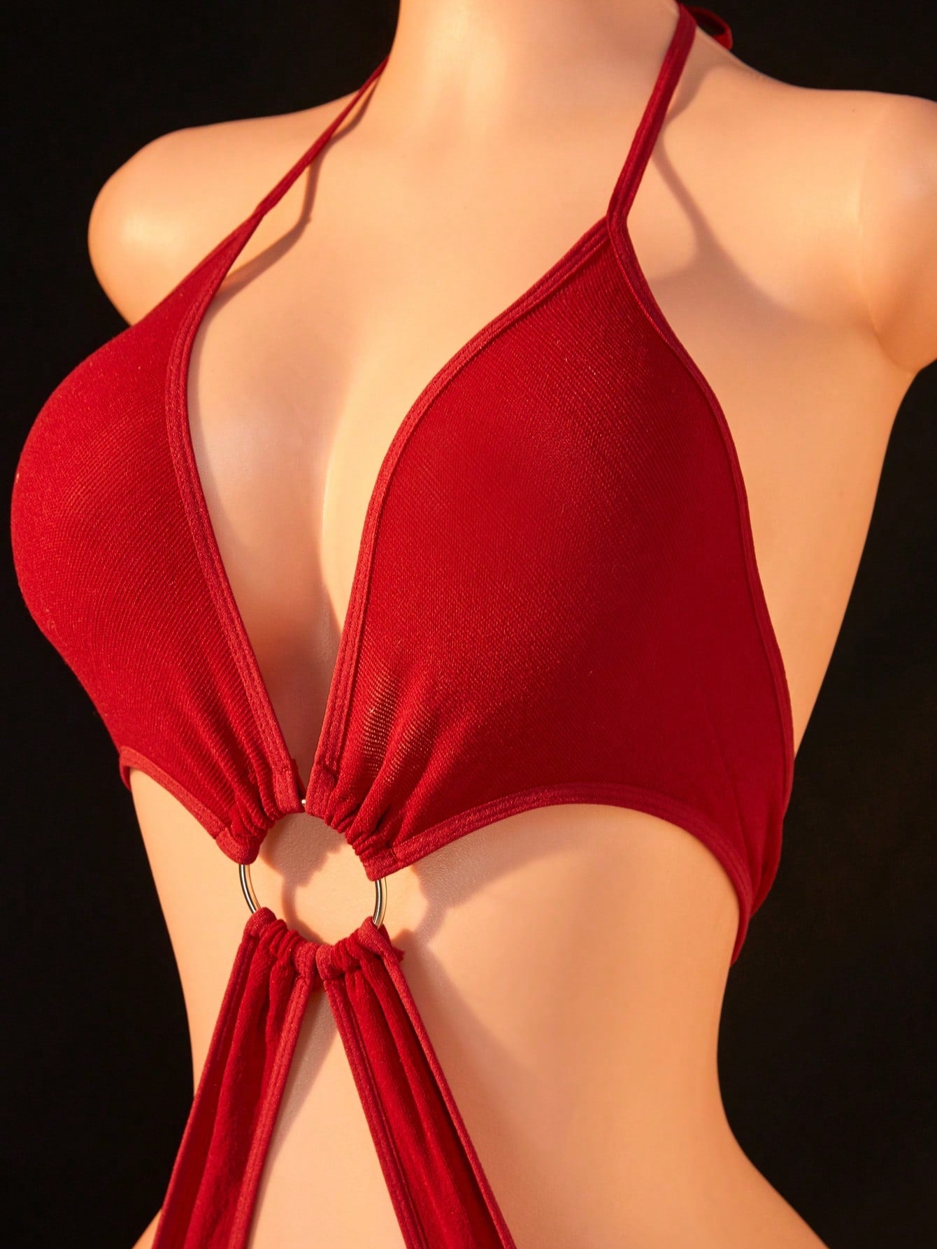 Red women's mesh bodysuit with halter neckline, sleeveless backless design, plain pattern, and high-stretch knitted fabric.