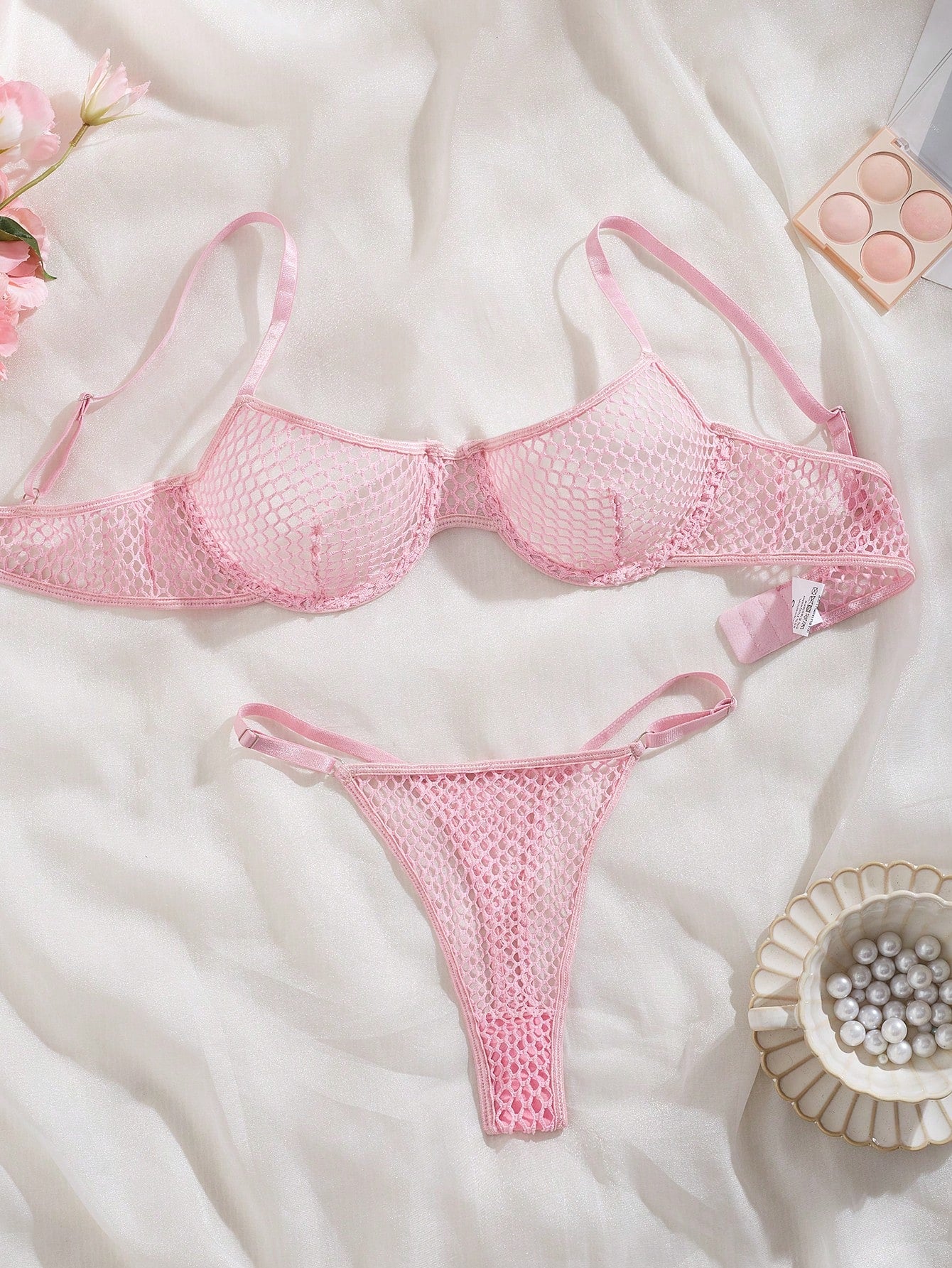 Women's 2-piece mesh lingerie set with hollow out detail, underwire bra, adjustable spaghetti straps, and matching low-rise thong panties in a sheer plain design.