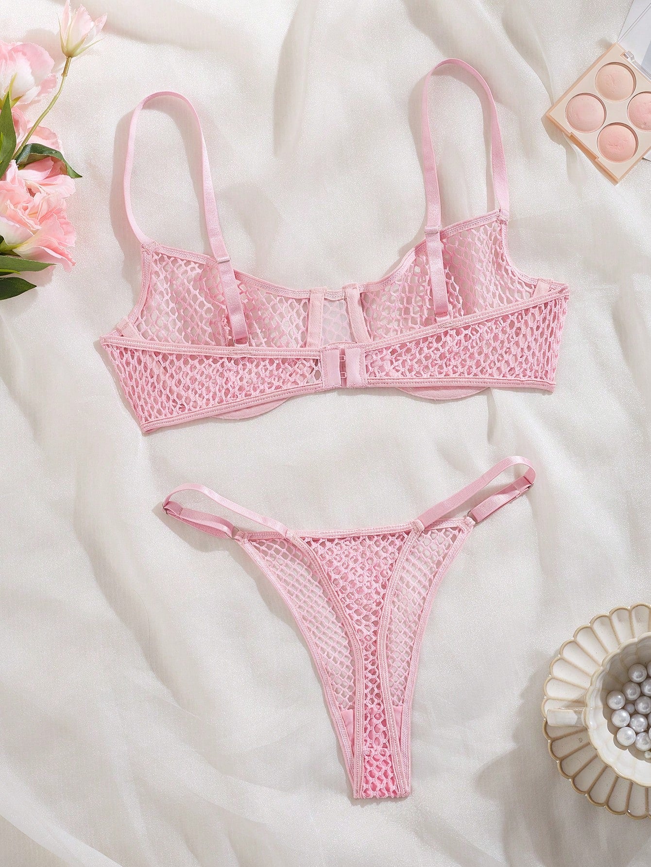 Women's 2-piece mesh lingerie set with hollow out detail, underwire bra, adjustable spaghetti straps, and matching low-rise thong panties in a sheer plain design.