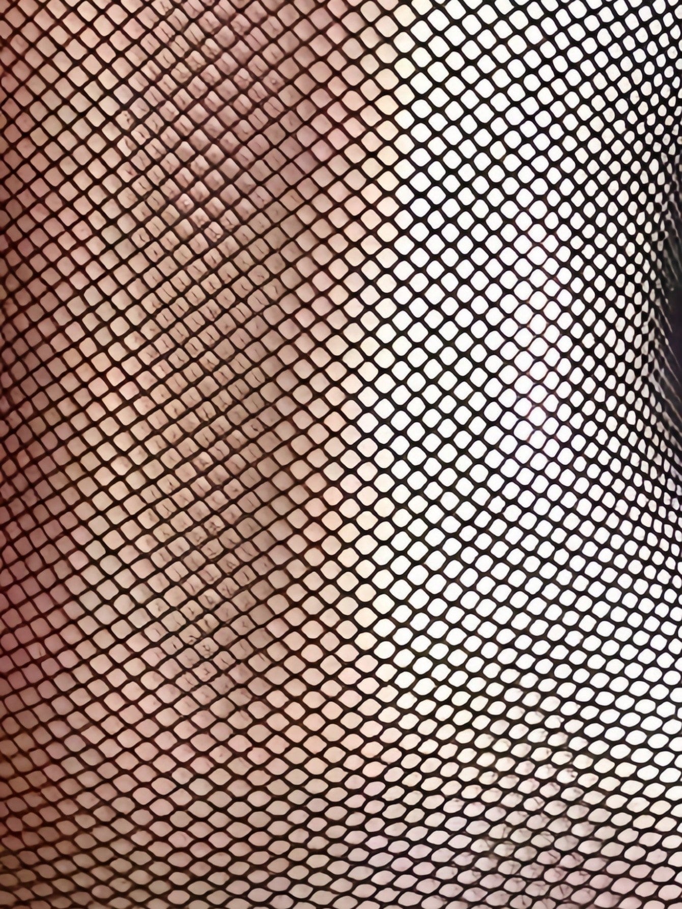 Black sheer fishnet bodystocking for women with cut-out detail, crossback straps, scoop neckline, and sleeveless high-stretch design.