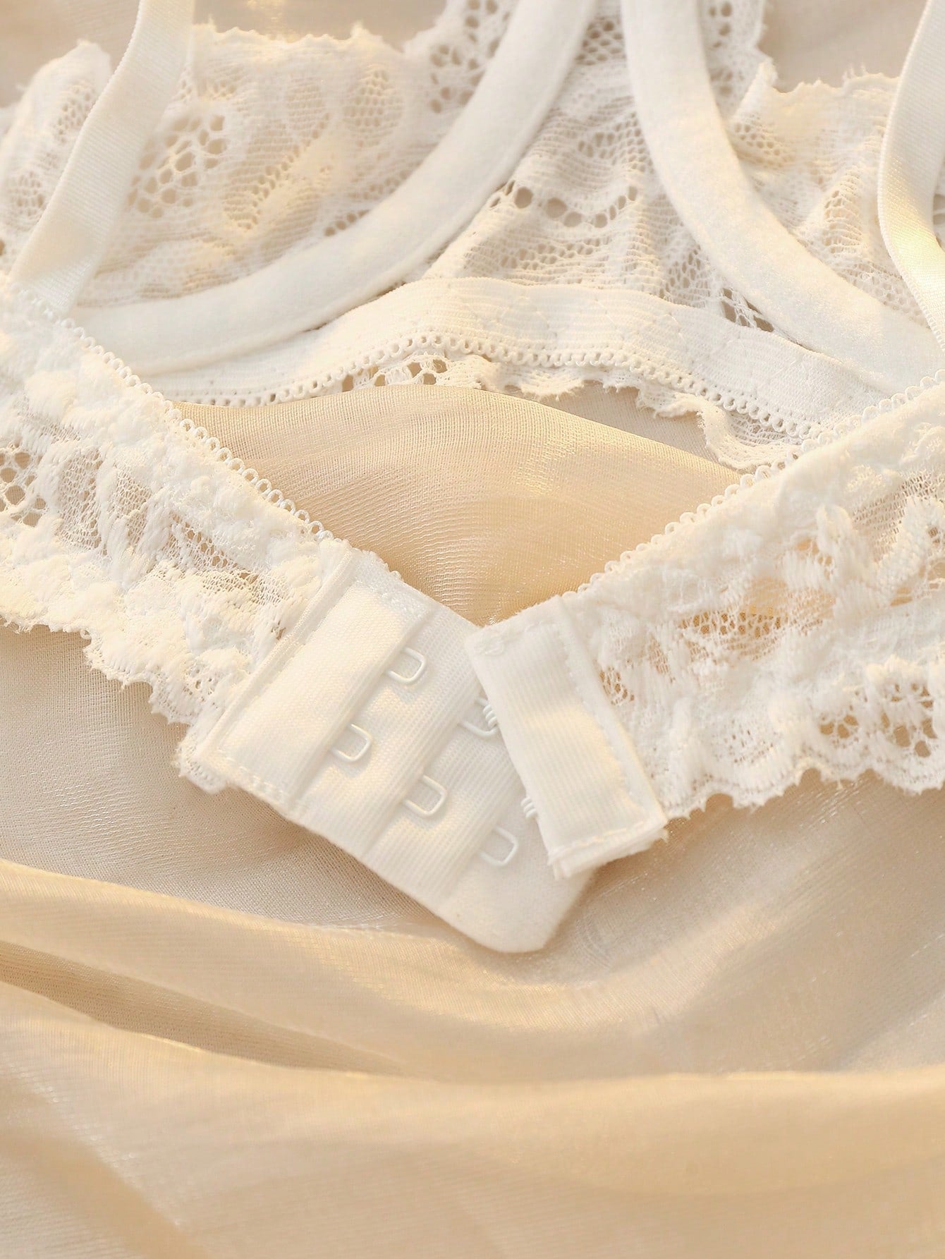 Women's sheer lace underwire bra and thong set with open cup bra, adjustable spaghetti straps, and matching low rise V-string thong in a 2-piece lingerie set.