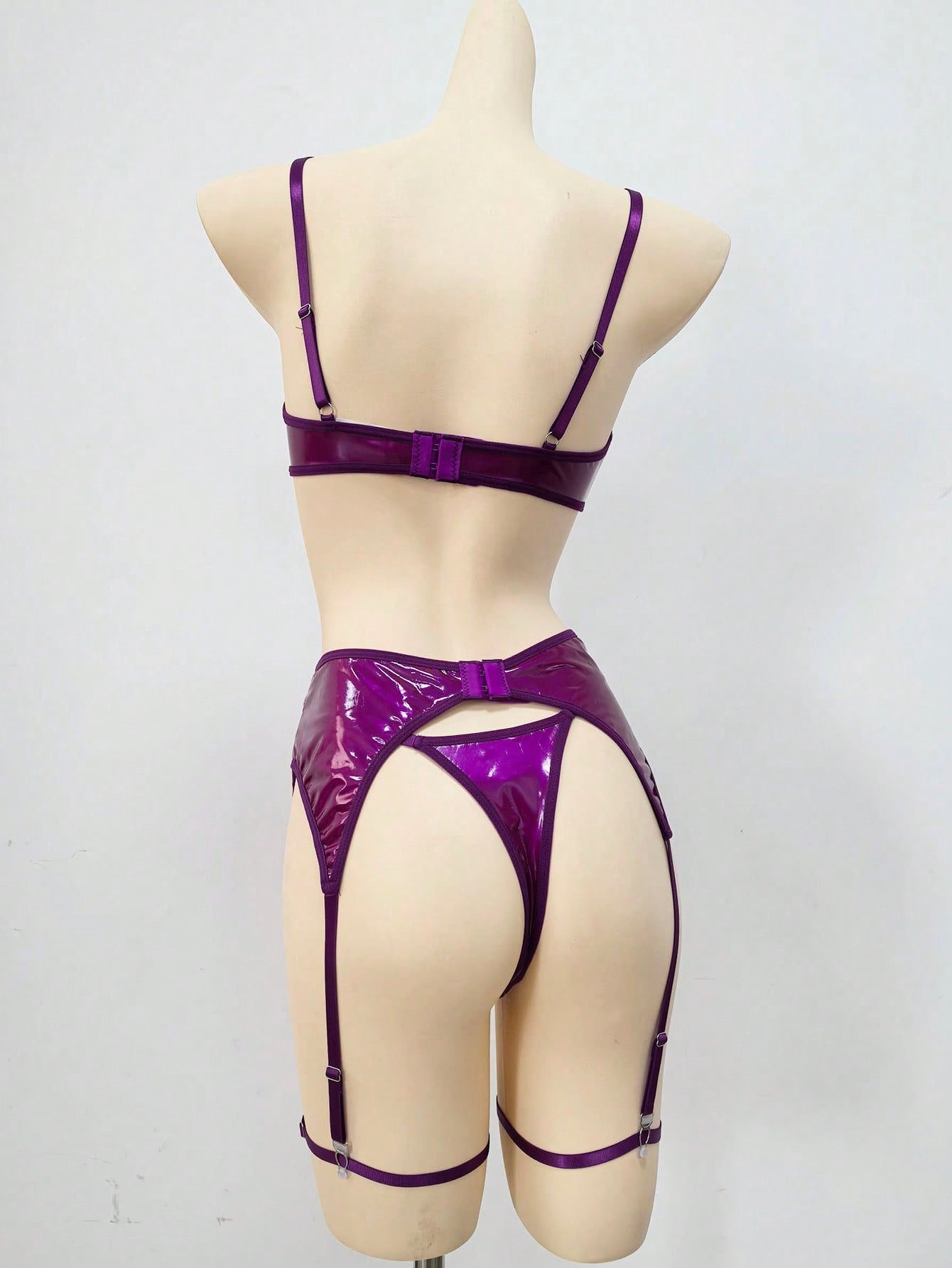 Women's 4-piece wireless lingerie set with cut-out bralette, adjustable spaghetti straps, V-string panty, and matching body accessories in plain style.