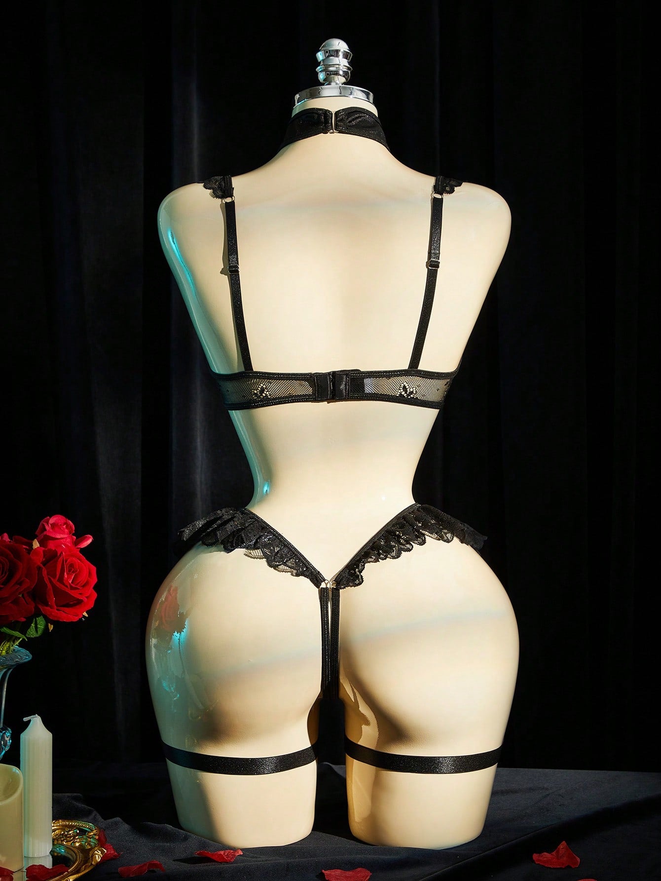 Black 4-piece women's lingerie set with contrast lace, bow detail, hollow out design, halter camisole bra, adjustable straps, underwire support, and matching low-rise thongs.