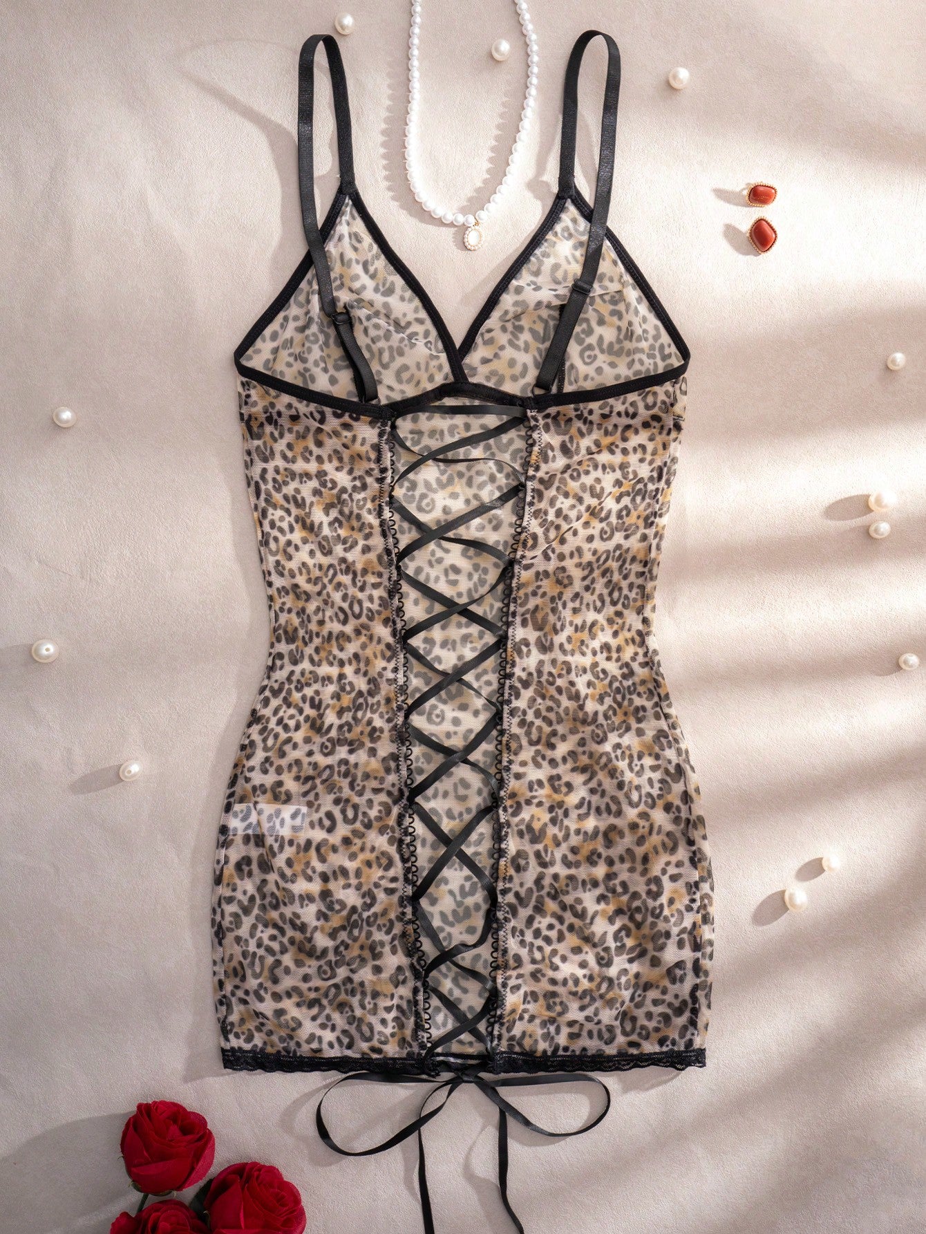 Women's leopard print semi-sheer mesh nightdress with backless tie-up design, criss cross cut out details, adjustable spaghetti straps, and wireless stretch fit.
