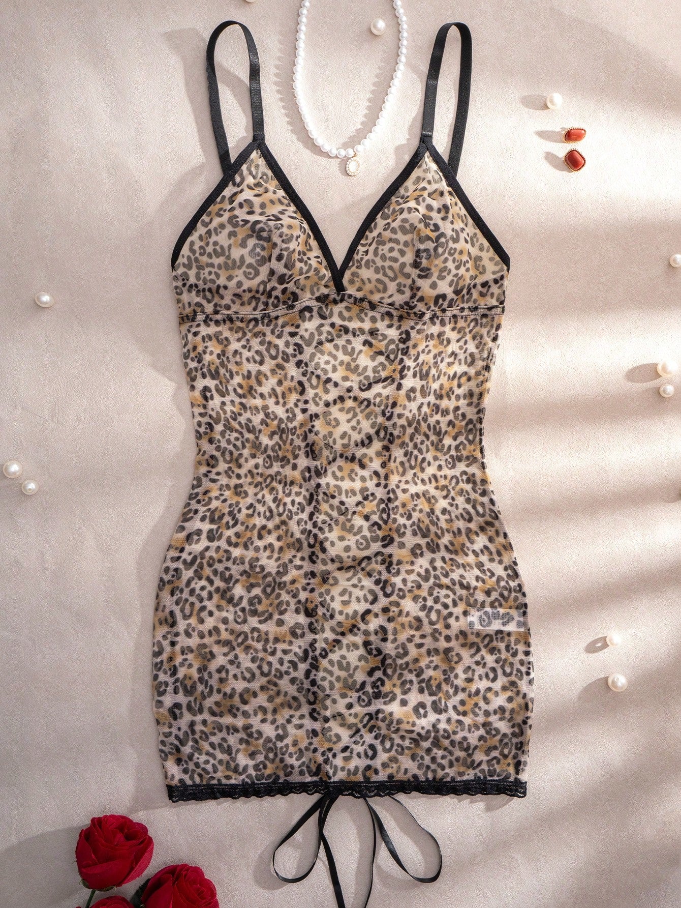 Women's leopard print semi-sheer mesh nightdress with backless tie-up design, criss cross cut out details, adjustable spaghetti straps, and wireless stretch fit.