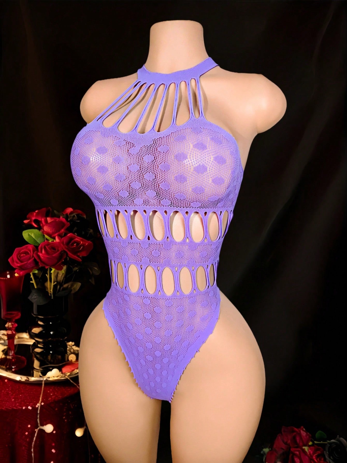 Women's fishnet sheer bodysuit with spaghetti straps, boat neckline, cut-out detail, sleeveless design, and high-stretch knitted fabric.