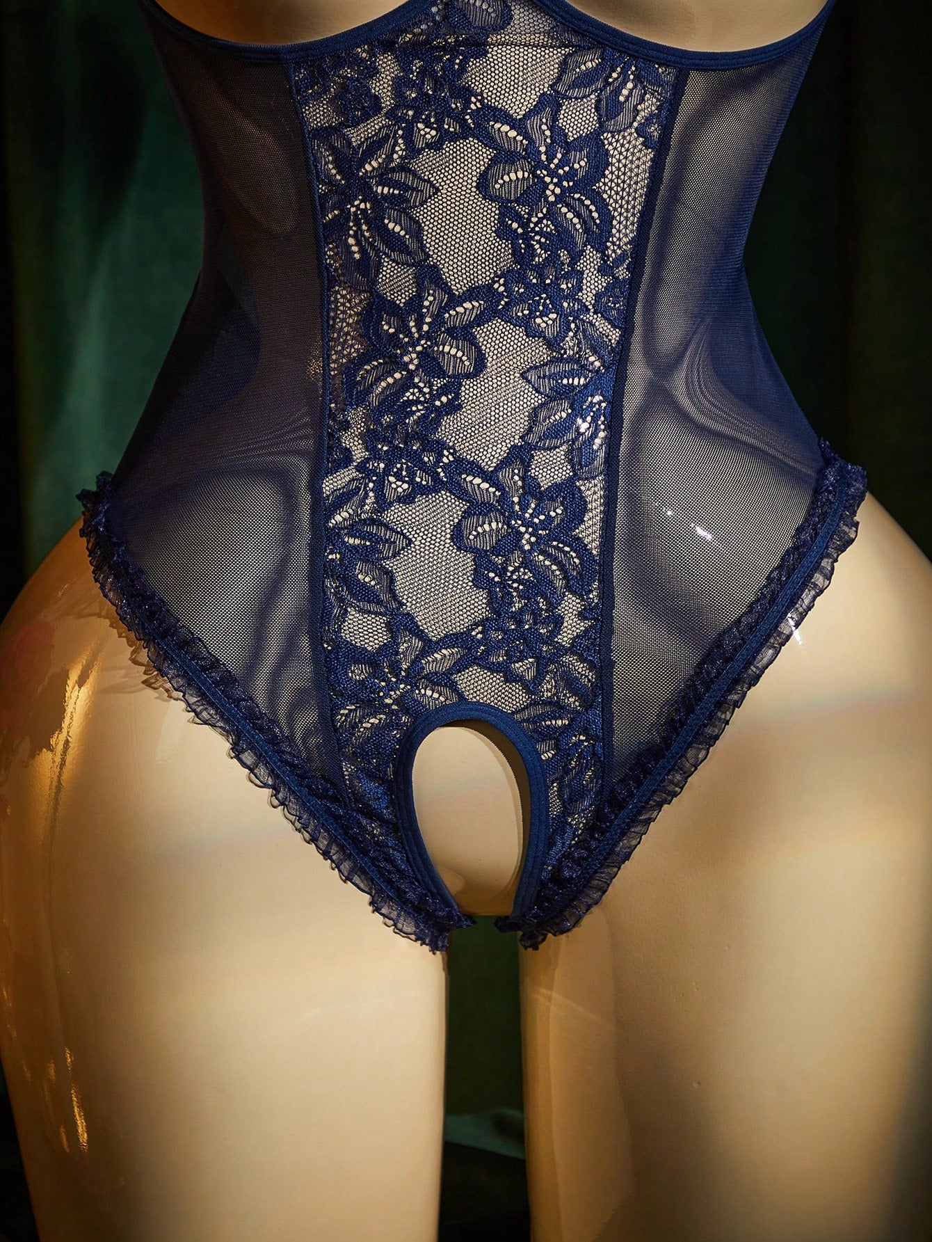 Women's lace mesh lingerie bodysuit with sheer patchwork, backless design, adjustable spaghetti straps, and wireless high-stretch fit.