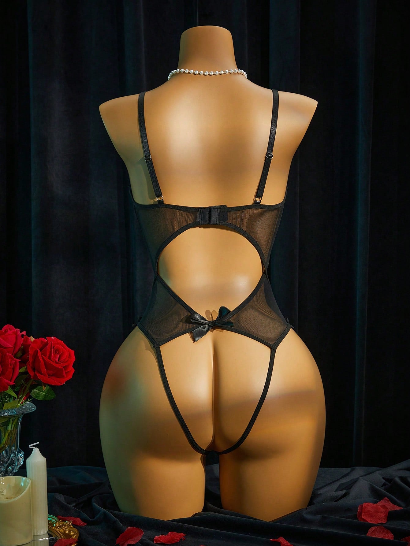 Women's lace mesh lingerie bodysuit with sheer patchwork, backless design, adjustable spaghetti straps, and wireless high-stretch fit.