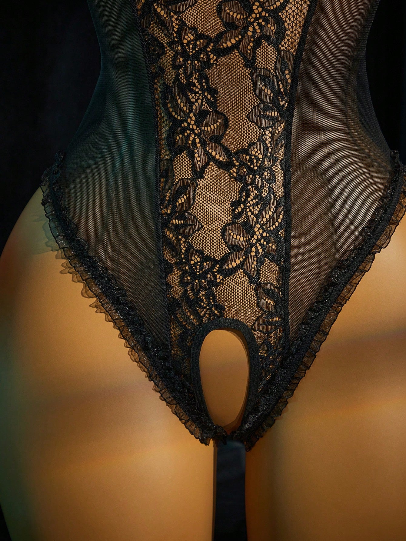 Women's lace mesh lingerie bodysuit with sheer patchwork, backless design, adjustable spaghetti straps, and wireless high-stretch fit.