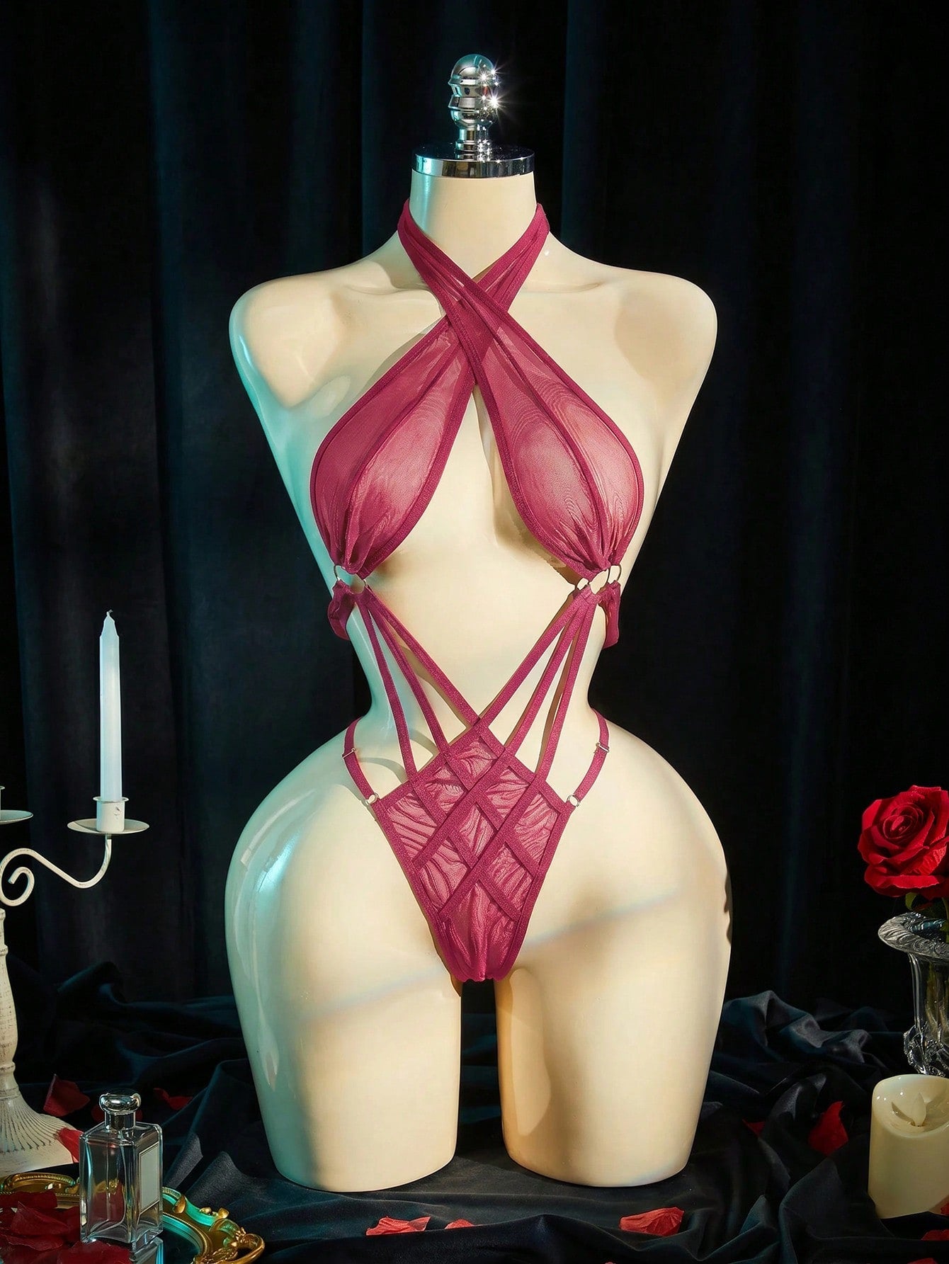 Women's black sheer mesh bodysuit with halter neckline, backless design, wireless fit, and plain finish.