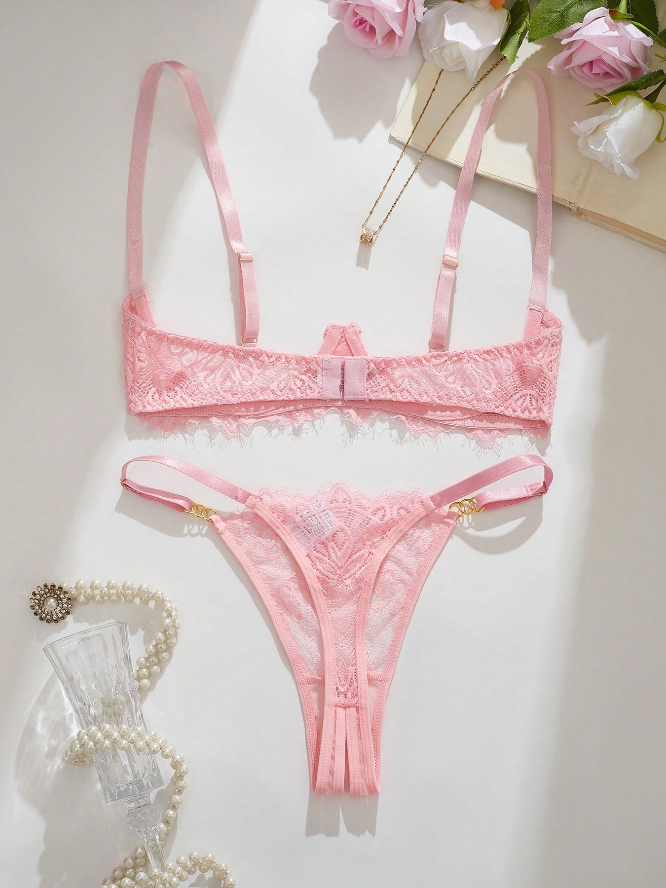 Women's lace bra and panty set with underwire bra, adjustable straps, 3/4 cup design, and matching thong panty in a sheer 2-piece lingerie style.