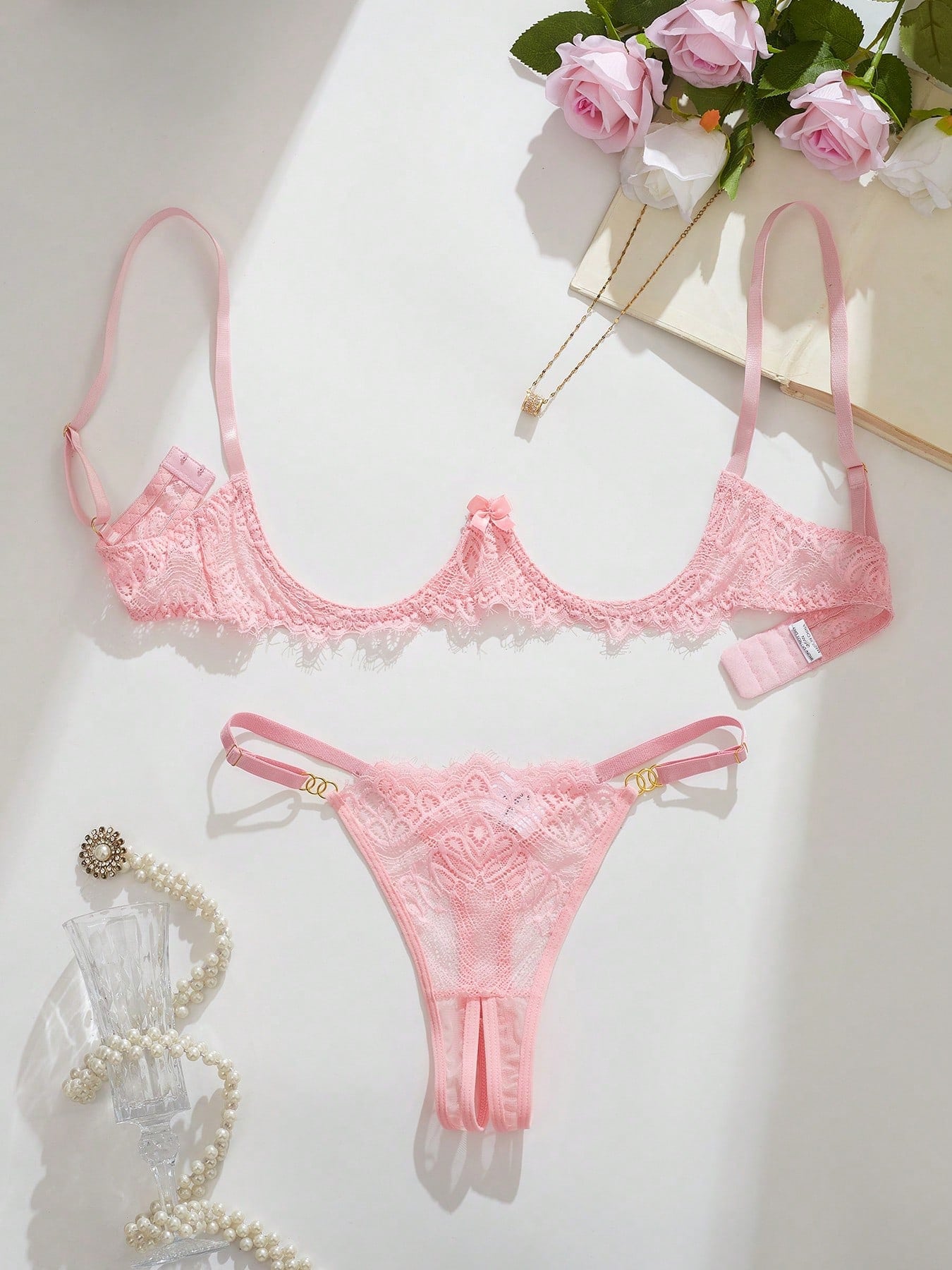 Women's lace bra and panty set with underwire bra, adjustable straps, 3/4 cup design, and matching thong panty in a sheer 2-piece lingerie style.