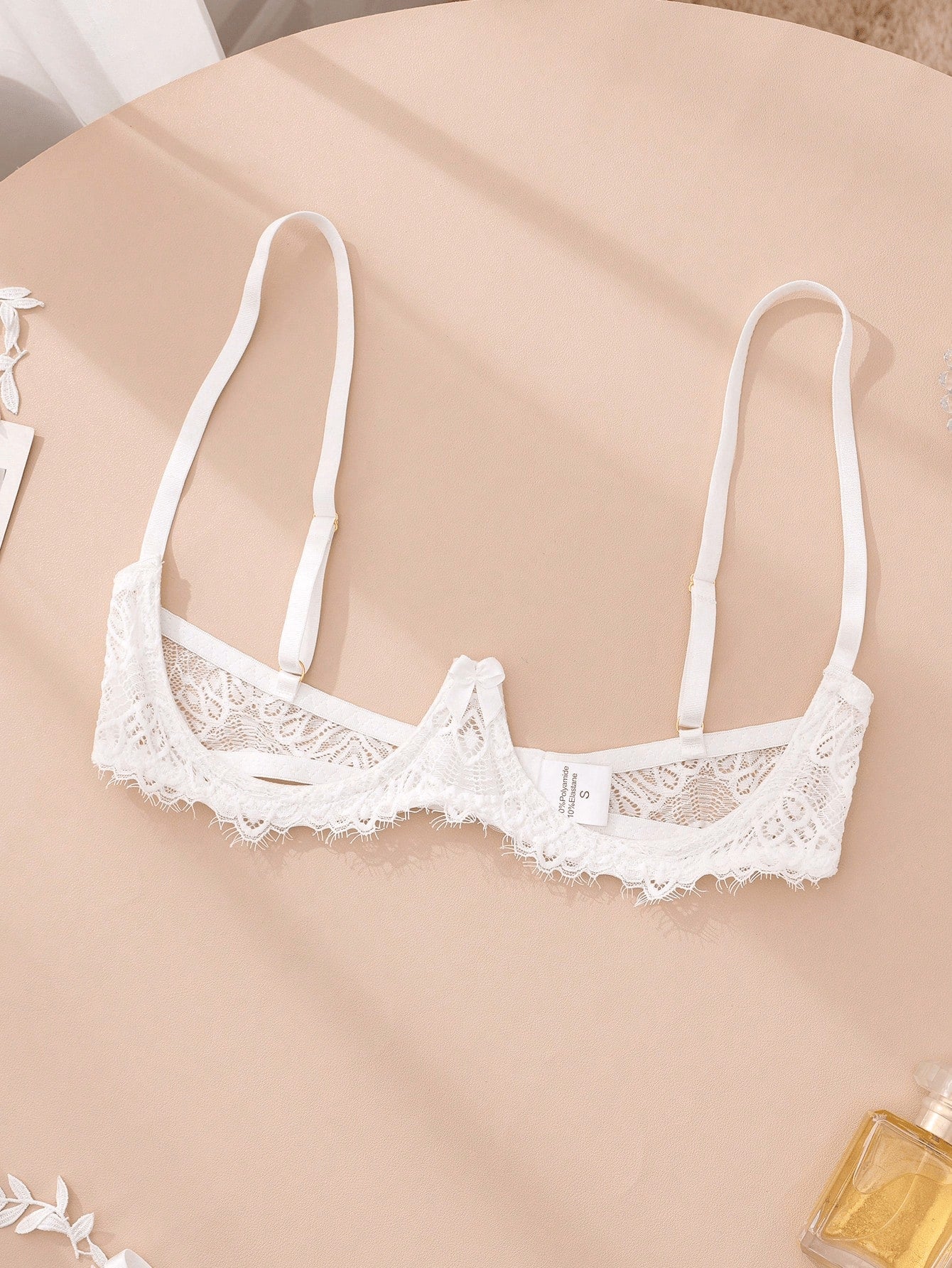 Women's lace bra and panty set with underwire bra, adjustable straps, 3/4 cup design, and matching thong panty in a sheer 2-piece lingerie style.