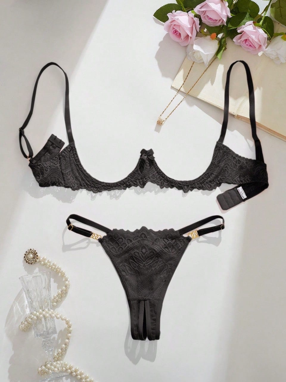 Women's lace bra and panty set with underwire bra, adjustable straps, 3/4 cup design, and matching thong panty in a sheer 2-piece lingerie style.