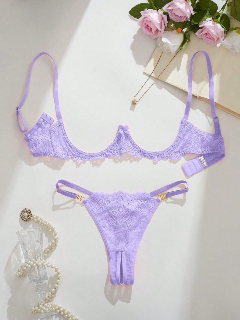 Women's lace bra and panty set with underwire bra, adjustable straps, 3/4 cup design, and matching thong panty in a sheer 2-piece lingerie style.