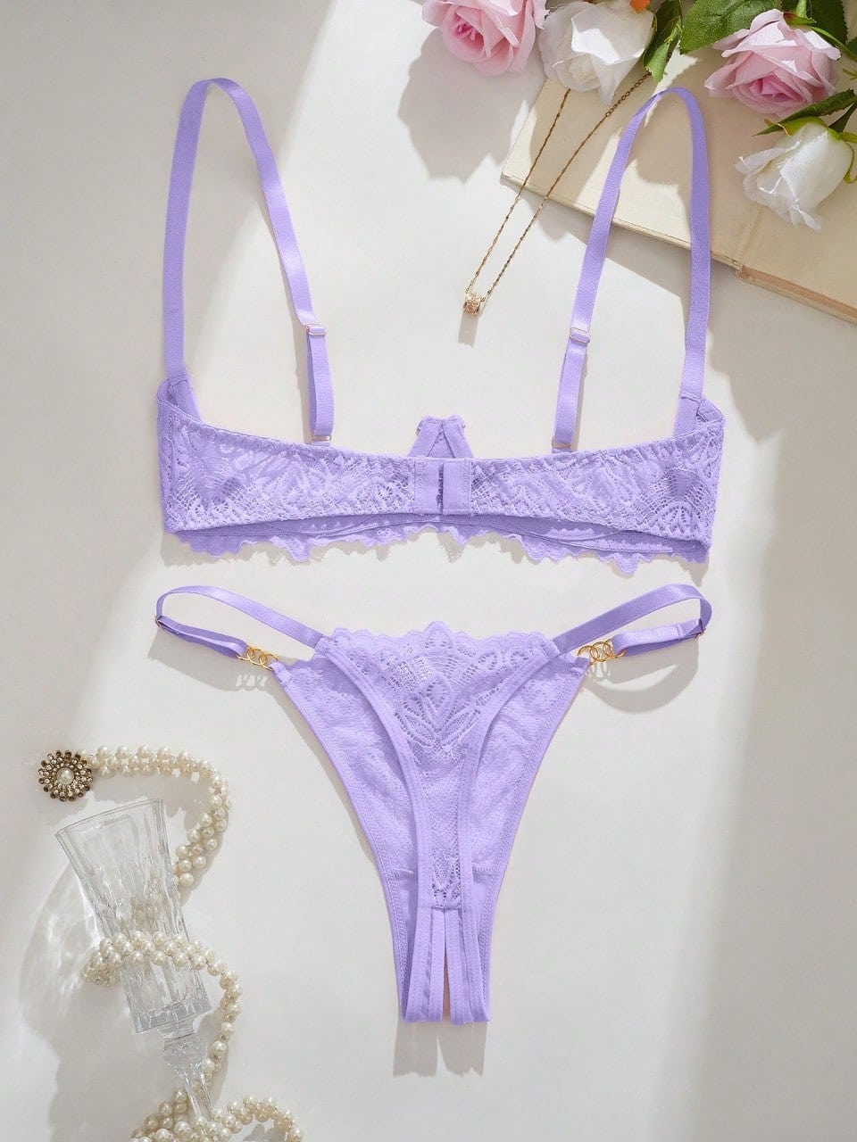 Women's lace bra and panty set with underwire bra, adjustable straps, 3/4 cup design, and matching thong panty in a sheer 2-piece lingerie style.