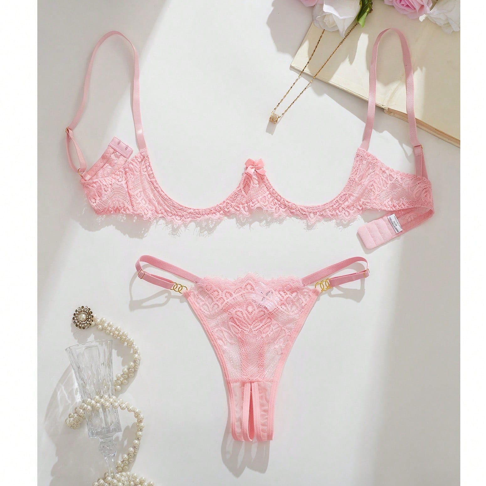 Women's lace bra and panty set with underwire bra, adjustable straps, 3/4 cup design, and matching thong panty in a sheer 2-piece lingerie style.